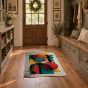 Colorful vintage geometric figurative art area rug displayed in a refined hallway