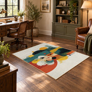 Colorful vintage geometric family portrait area rug angled view in a classic bedroom