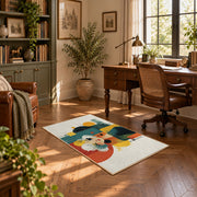 Colorful vintage geometric family portrait area rug displayed in a sunlit home office