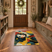 Colorful vintage geometric floral portrait area rug displayed in a refined hallway