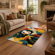 Colorful vintage geometric floral portrait area rug shown beside a comfortable sofa