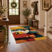 Colorful vintage geometric child portrait area rug styled in a welcoming entryway