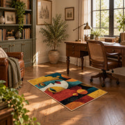 Colorful vintage geometric child portrait area rug displayed in a sunlit home office