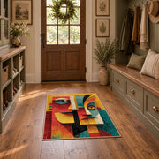 Colorful vintage geometric twin faces area rug displayed in a refined hallway