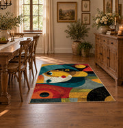 Colorful vintage geometric child portrait area rug shown in a bright dining space