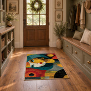 Colorful vintage geometric child portrait area rug displayed in a refined hallway