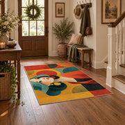 Colorful vintage geometric girl portrait area rug styled in a welcoming entryway