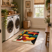 Colorful vintage geometric fruit still life area rug placed in a modern laundry room