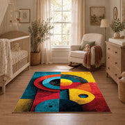 Colorful vintage geometric cubist face area rug shown in a calm nursery