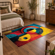 Colorful vintage geometric cubist face area rug displayed beside a cozy bed