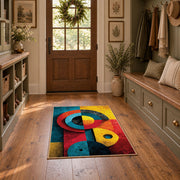 Colorful vintage geometric cubist face area rug displayed in a refined hallway