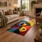Colorful vintage geometric cubist face area rug shown beside a comfortable sofa