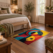 Colorful vintage geometric cubist face area rug styled in a restful bedroom