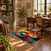 Colorful vintage geometric cubist face area rug displayed in a sunlit home office