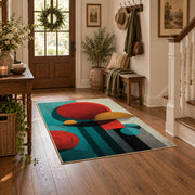 Colorful vintage geometric tree art area rug styled in a welcoming entryway