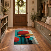 Colorful vintage geometric tree art area rug displayed in a refined hallway