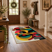 Colorful vintage geometric retro floral area rug styled in a welcoming entryway
