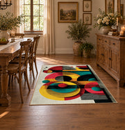 Colorful vintage geometric retro floral area rug shown in a bright dining space