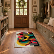 Colorful vintage geometric retro floral area rug displayed in a refined hallway