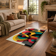 Colorful vintage geometric retro floral area rug shown beside a comfortable sofa