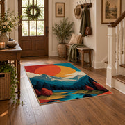 Colorful vintage geometric mountain landscape area rug styled in a welcoming entryway