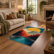 Colorful vintage geometric mountain vista area rug shown beside a comfortable sofa