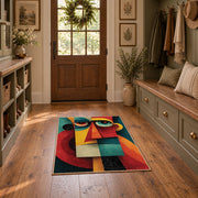 Colorful vintage geometric geometric faces area rug displayed in a refined hallway