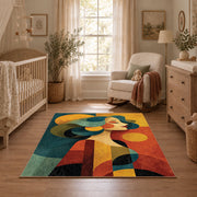 Colorful vintage geometric family portrait area rug shown in a calm nursery