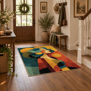 Colorful vintage geometric family portrait area rug styled in a welcoming entryway