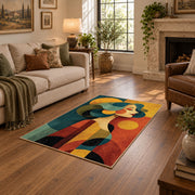 Colorful vintage geometric family portrait area rug shown beside a comfortable sofa
