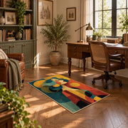 Colorful vintage geometric family portrait area rug displayed in a sunlit home office