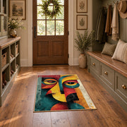 Colorful vintage geometric cubist face area rug displayed in a refined hallway