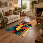 Colorful vintage geometric cubist face area rug shown beside a comfortable sofa