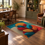 Colorful vintage geometric autumn leaves area rug angled view in a classic bedroom
