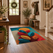 Colorful vintage geometric autumn leaves area rug styled in a welcoming entryway