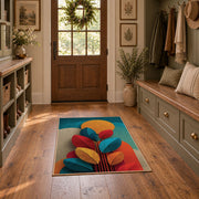 Colorful vintage geometric autumn leaves area rug displayed in a refined hallway