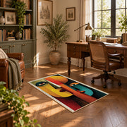 Colorful vintage geometric profile portrait area rug displayed in a sunlit home office