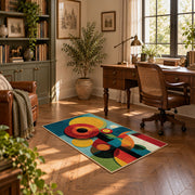 Colorful vintage geometric geometric flowers area rug displayed in a sunlit home office