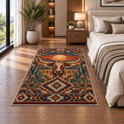 Longhorn Desert Diamond Rug shown beside a bed with neutral bedding