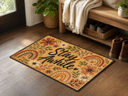 Suupia Stay Awhile doormat with boho flowers and rainbows, styled view 2