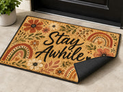 Suupia Stay Awhile doormat with boho flowers and rainbows, styled view 3